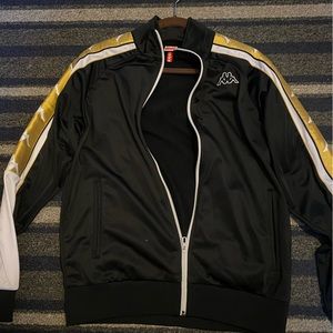 Black and gold kappa tracksuit top.
